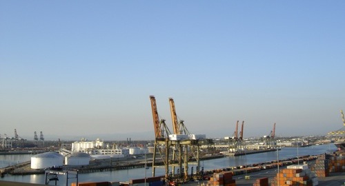 cranes, water, containers, and smog