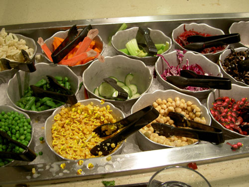 vegetables at the dining commons salad bars with photoshopped toys inside the bowls
