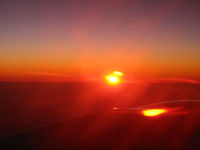 The view of the sunset from the airplane.
