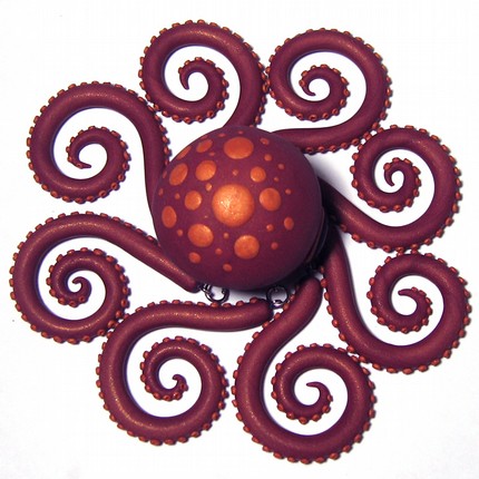 a purple octopus made of polymer clay, seen from above