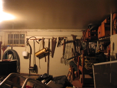 old farm implements and other things hung on the wall