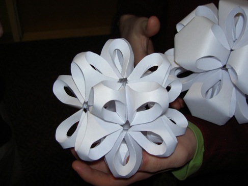 the paper polyhedra in somebody's hands