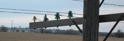 A pole with glass insulators